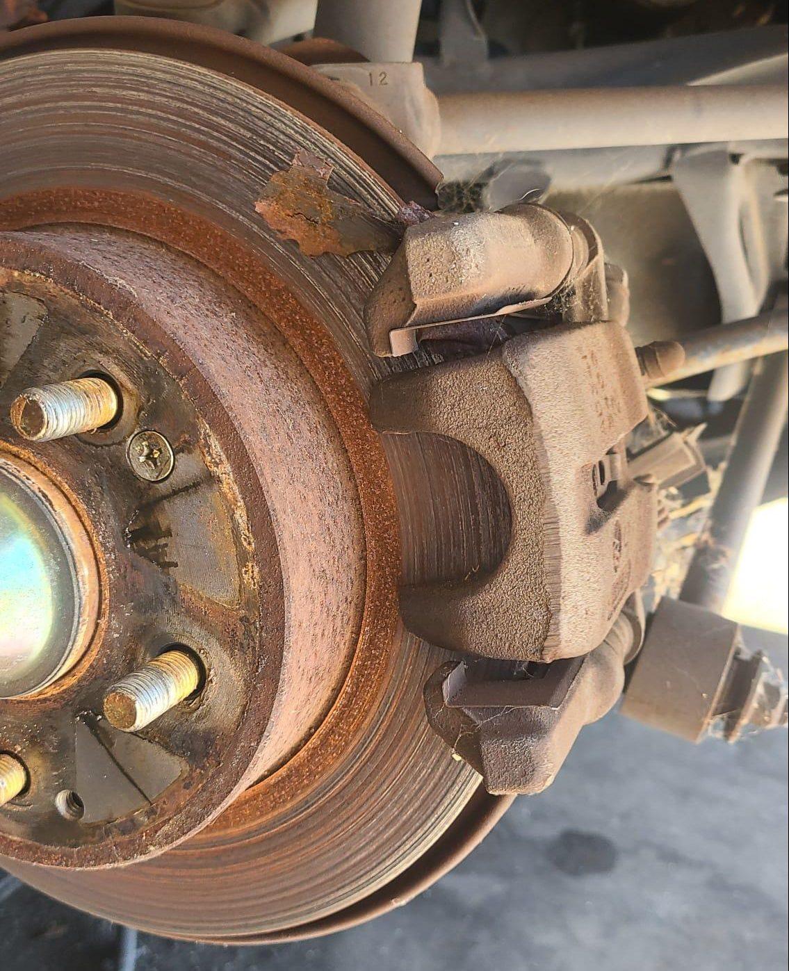 image of worn down rotors and pads