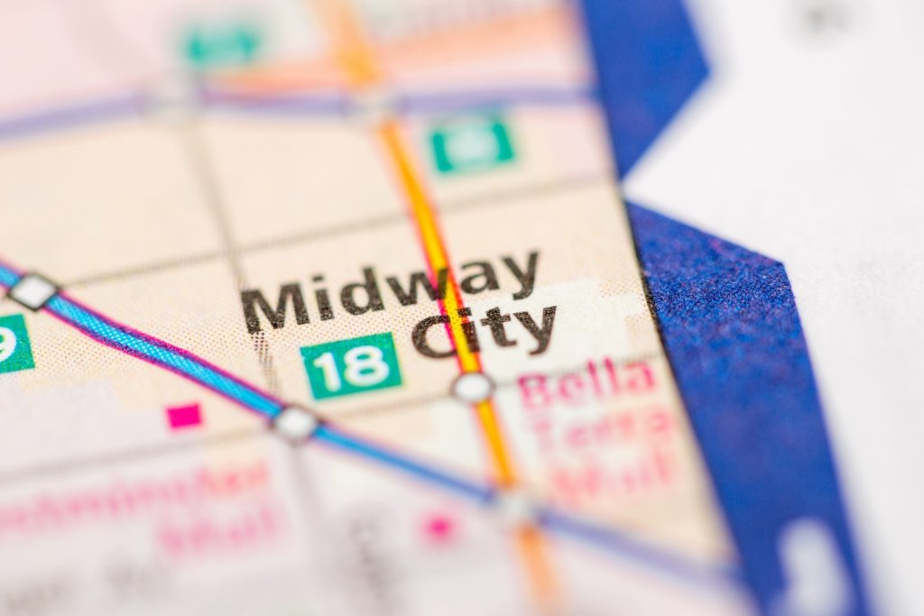 Close-up of a printed map showing Midway City, California, with highways and nearby areas highlighted.